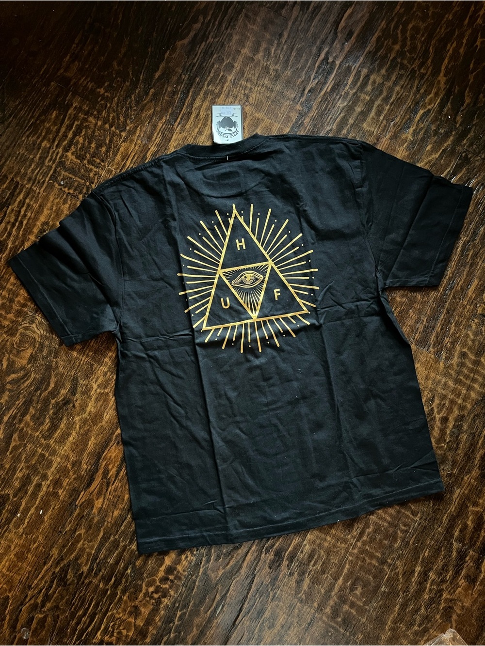 HUF Black Graphic T-Shirt with Gold Illuminated Eye Triangle Logo Large